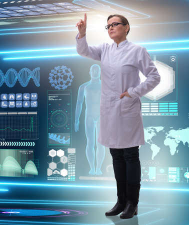 The woman doctor in telemedicine health conceptの写真素材