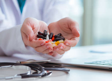 Medical concept with medicines and laptop computerの写真素材