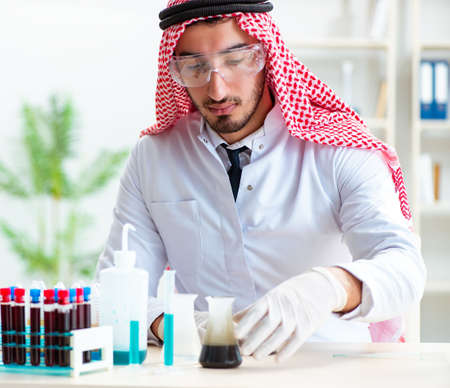 Arab chemist working in the lab officeの写真素材