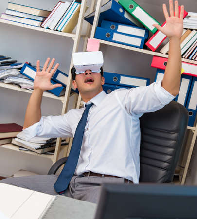 The employee watching movie on vr virtual reality glasses