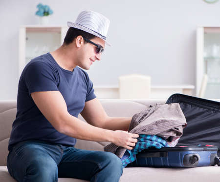 Man with hat preparing for summer vacationの写真素材