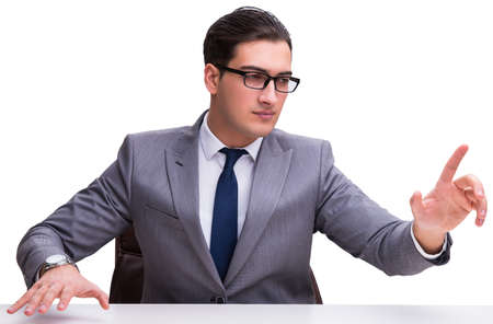 Young businessman pressing virtual buttons isolated on white bacの写真素材