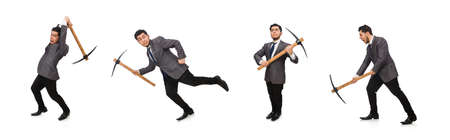 The young businessman holding a tool isolated on whiteの写真素材