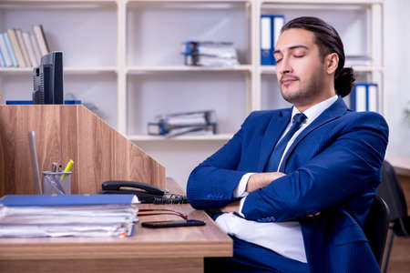 Young handsome businessman working in the officeの写真素材