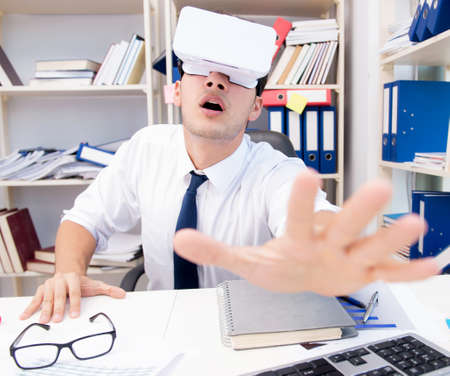 The employee watching movie on vr virtual reality glasses