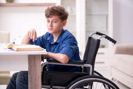 Disabled kid preparing for school at homeの写真素材