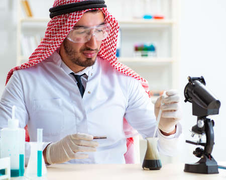 Arab chemist working in the lab officeの写真素材