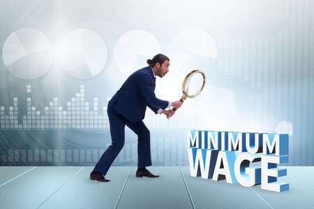Concept of minimum wage with businessmanの写真素材