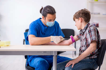 Young boy visiting doctor in hospitalの写真素材