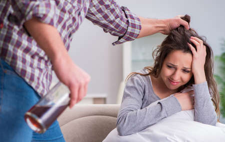 Domestic violence concept in a family argument with drunk alcohoの写真素材
