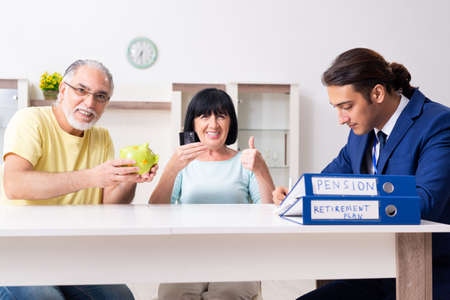 Financial advisor giving retirement advice to old coupleの写真素材