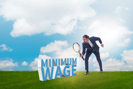 Concept of minimum wage with businessmanの写真素材