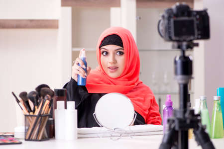 Beauty blogger in hijab recording video for her blogの写真素材