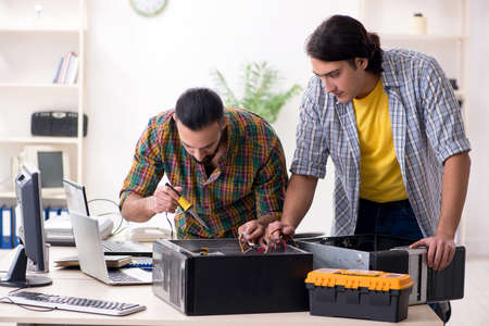 IT engineers working on hardware issueの写真素材