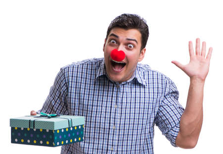 Man with a red nose funny holding a shopping bag gift present isの写真素材