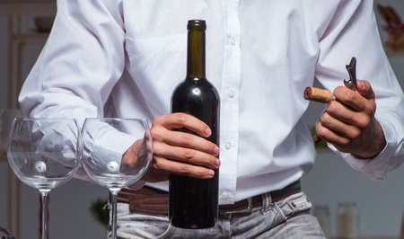 Professional sommelier tasting wine in restaurantの写真素材