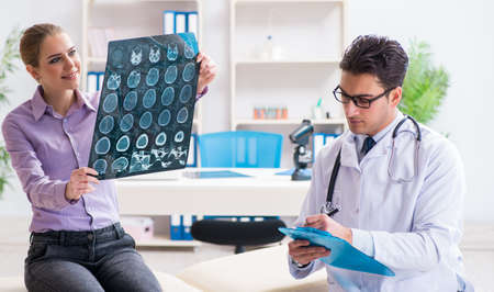 The doctor examining x-ray images of patient