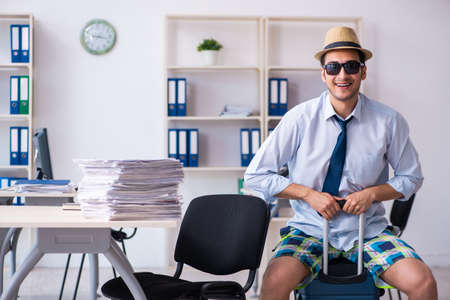 Young employee escaping for summer vacationの写真素材