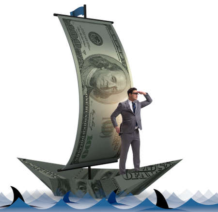 Businessman rowing on dollar boat in business financial conceptの写真素材