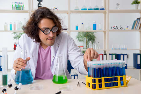 Funny male chemist working in the labの写真素材