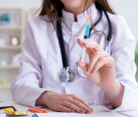 The doctor with syringe in the hospitalの写真素材
