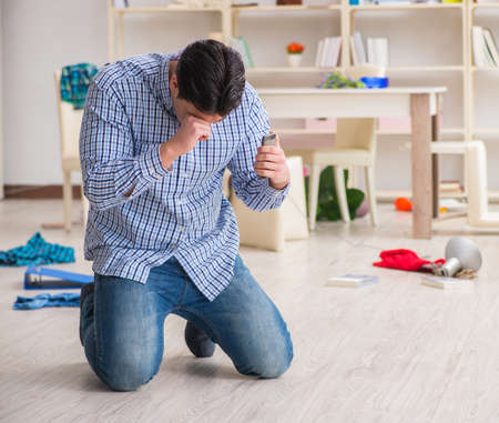 The man found his house after burglary robbed by burglarsの写真素材
