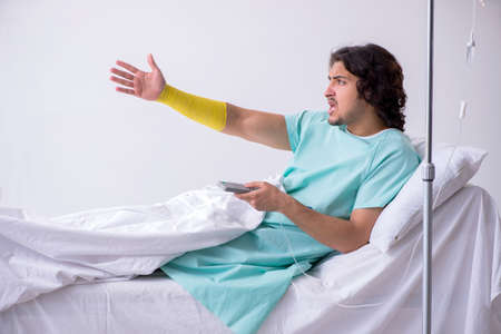 Young man staying in hospital in transfusion concept