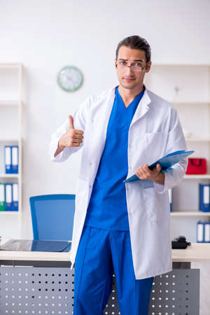 Young male doctor working in the clinicの写真素材