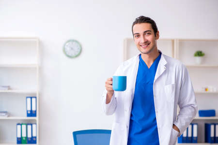 Young male doctor working in the clinicの写真素材