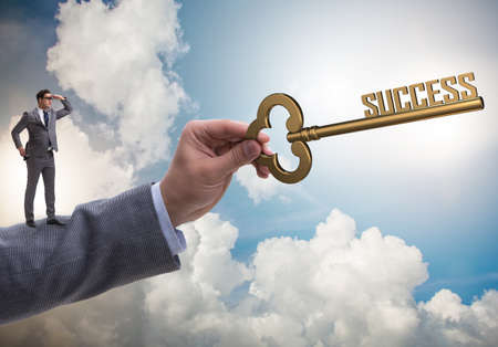 The businessman with key to success business conceptの写真素材