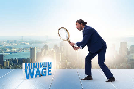 Concept of minimum wage with businessmanの写真素材