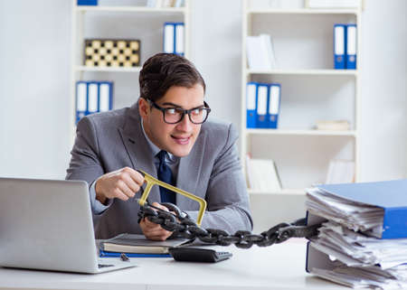 Busy employee chained to his office desk