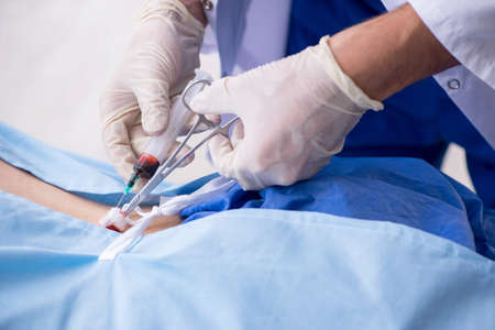 The female patient getting an injection in the clinic