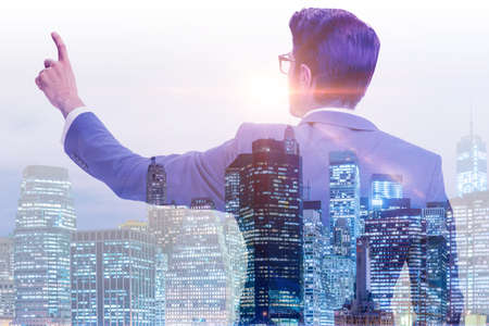 The successful businessman against cityscape in business conceptの写真素材