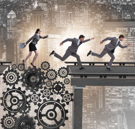 The business people crossing the bridge with cogwheelsの写真素材