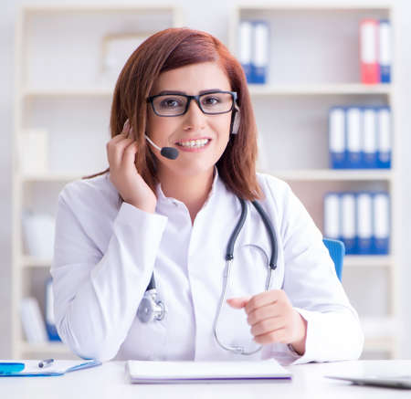Woman doctor in telemedicine conceptの写真素材