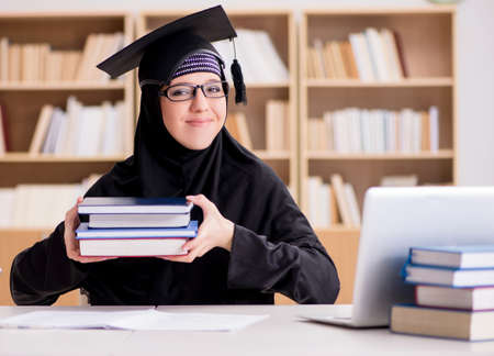 Muslim girl in hijab studying preparing for examsの写真素材