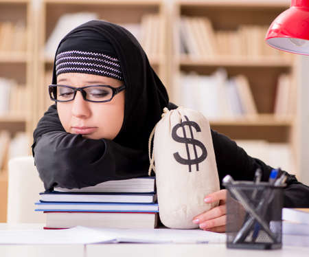 Muslim girl in hijab studying preparing for examsの写真素材