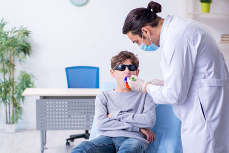 Young boy visiting doctor in hospitalの写真素材