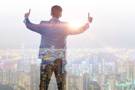 The successful businessman against cityscape in business concept