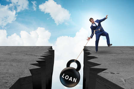 The concept of debt and load with businessman
