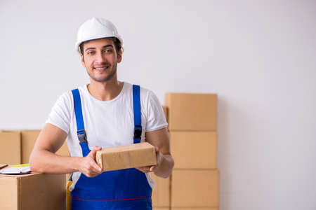 Young male professional mover doing home relocation