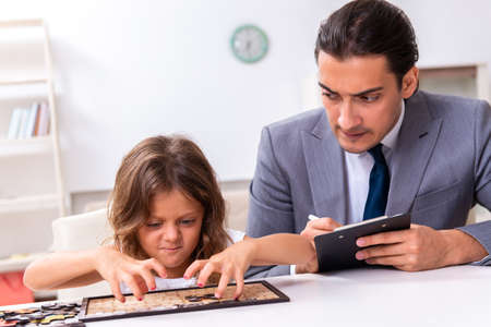 Child psychologist attending small girlの写真素材