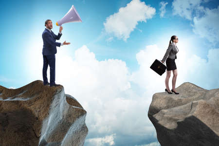 The businessman shouting with loudspeaker at othersの写真素材