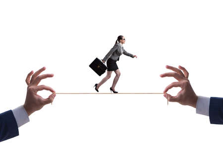 The businesswoman walking on tight ropeの写真素材