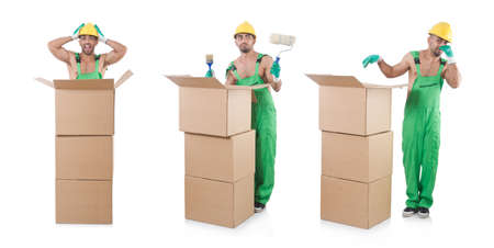 Man in green coveralls with boxesの写真素材