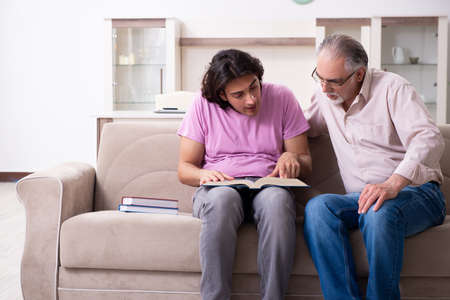 Young student and his fatherの写真素材