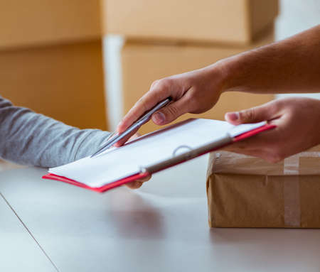 Delivery man delivering parcel box