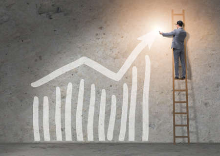 Young businessman facilitating economic growth conceptの写真素材