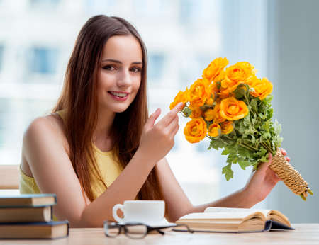 Young girl with present of flowersの写真素材
